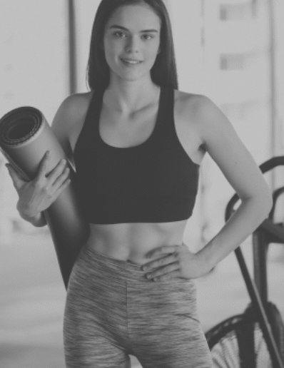 young-female-trainer-exercising-gym