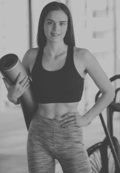 young-female-trainer-exercising-gym